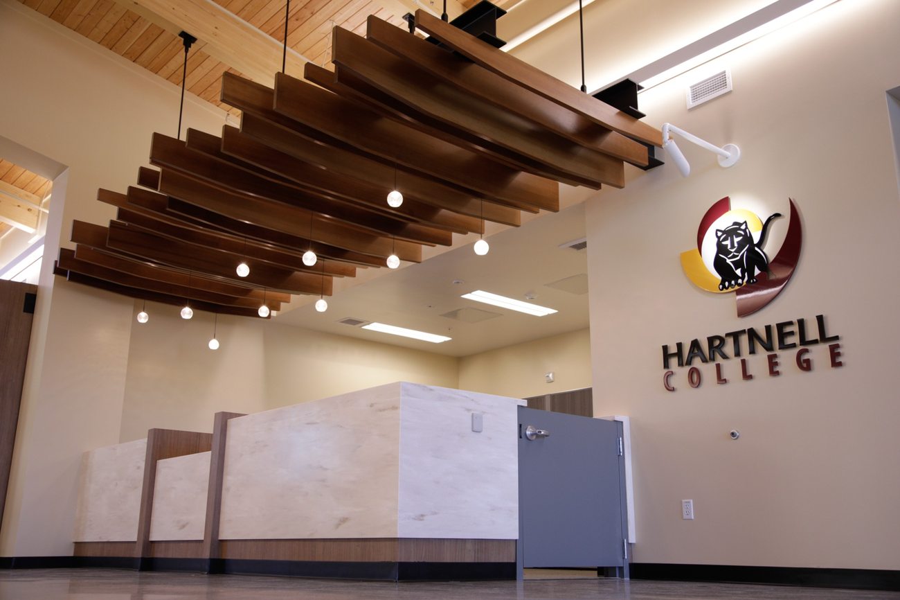 Hartnell College reception space with a sculptural wood ceiling feature